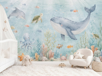 Watercolor under the sea nursery wall mural with whale, dolphin, turtle, octopus, and coral reef in soft blue coastal tones