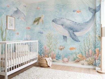 Watercolor under the sea nursery wall mural with whale, dolphin, turtle, octopus, and coral reef in soft blue coastal tones