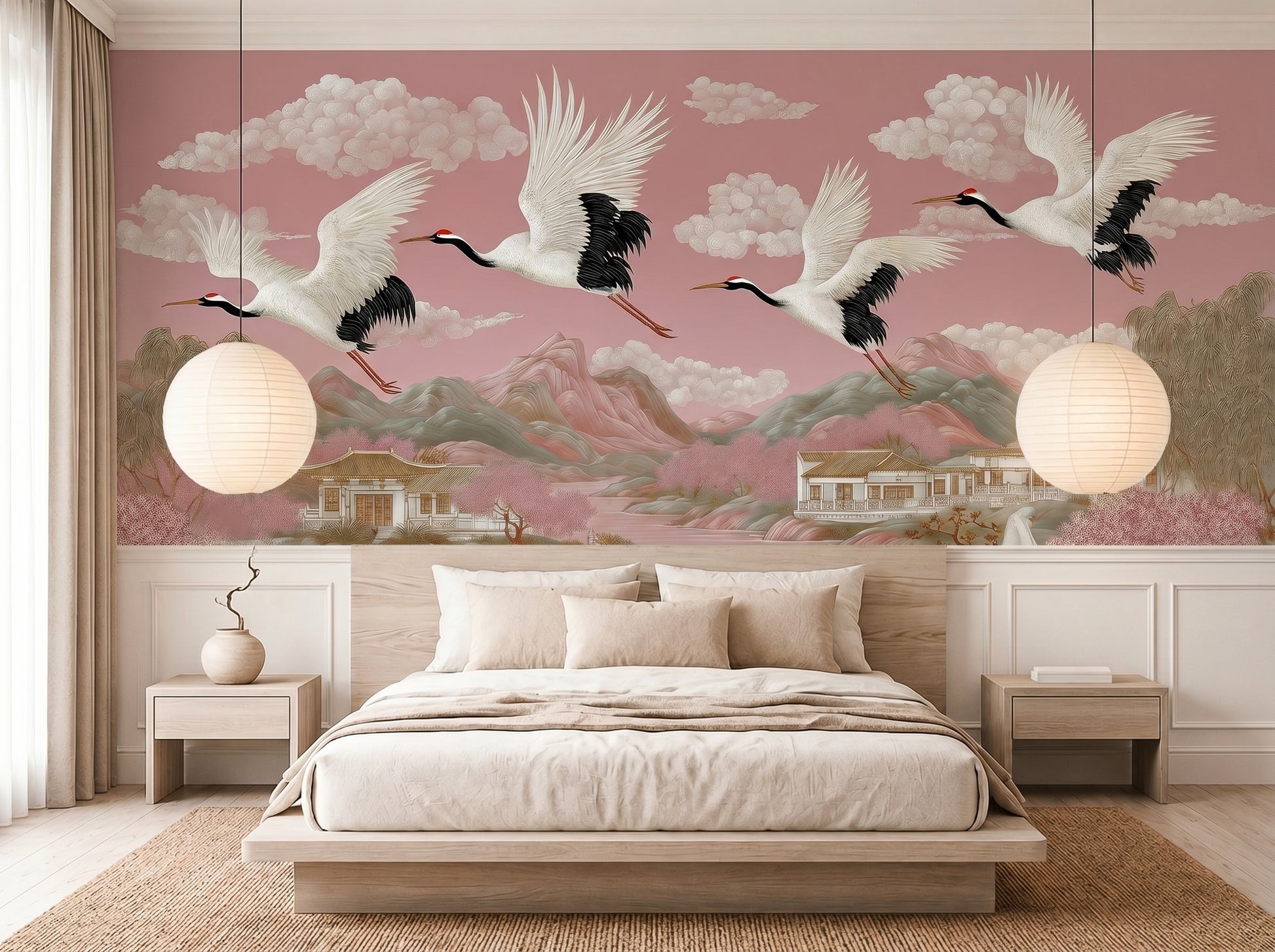 Blush pink chinoiserie crane wall mural in serene Japandi bedroom featuring flying Japanese cranes, pagodas, mountains, and cherry blossom landscape wallpaper with soft luxury Asian-inspired decor.